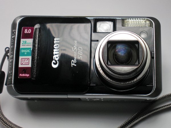 آموزش باز کردن قاب دوربین کانن PowerShot S80 — آموزش تعمیر